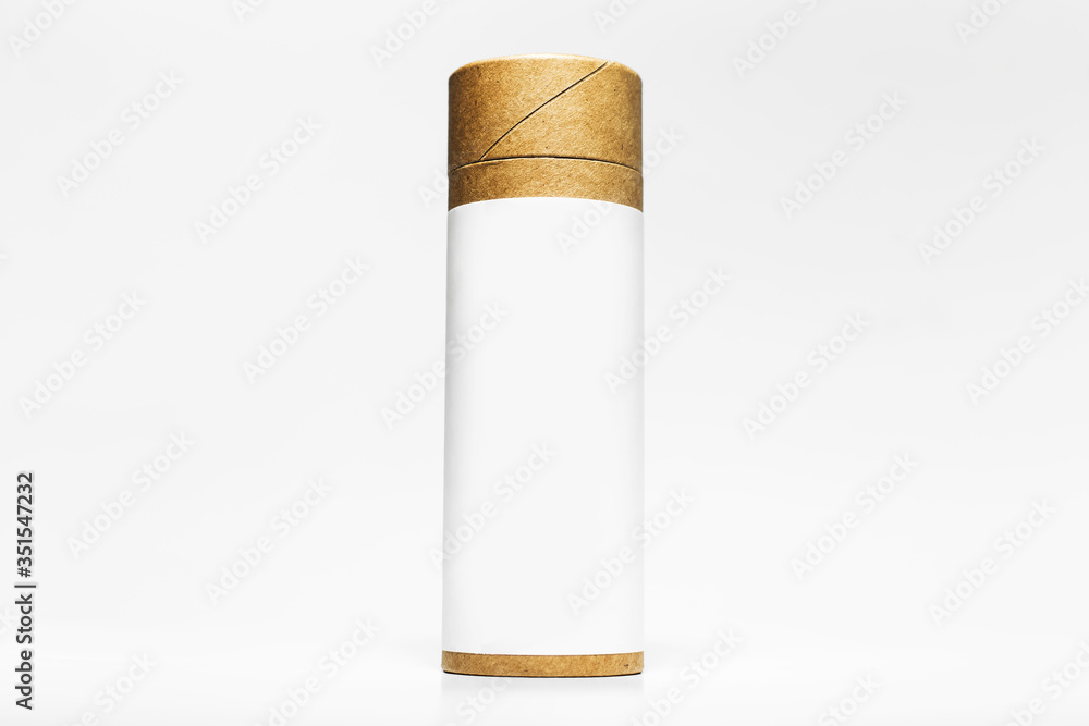 Close-up of cylinder cardboard box with empty sticker for mockup isolated on white studio background. Close-up of cylinder cardboard box with empty sticker for mockup isolated on white studio background.