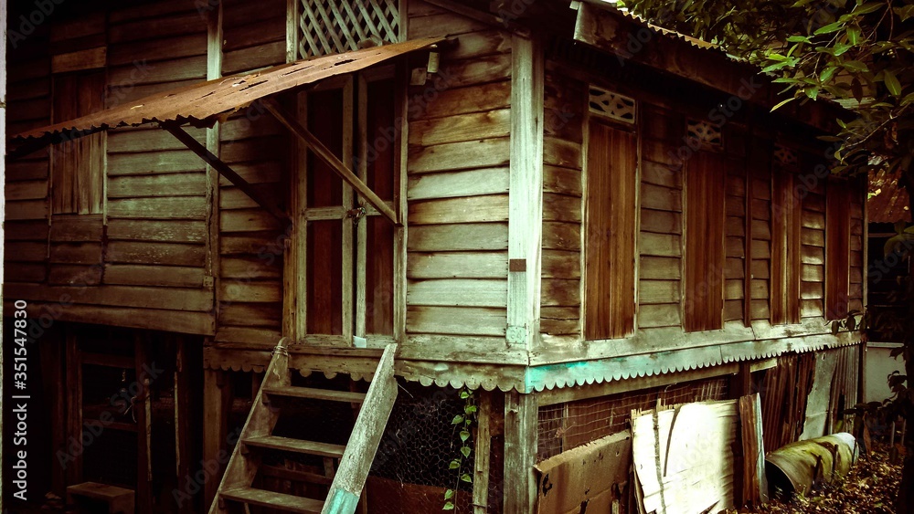 Wooden house with brown color with wooden stair