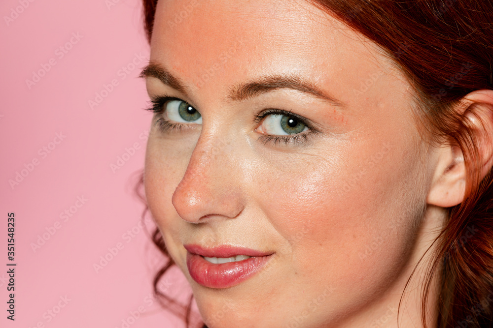 Fototapeta premium Beautiful woman with sun-kissed cheeks