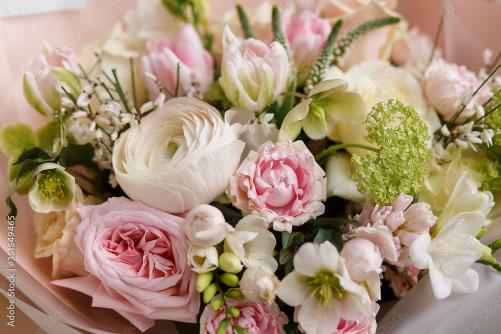 Spring pastel bouquet with roses closeup. Peony rose. Tulips,ranunculus. Flower shop. Spring. Florist. Flower Background. Wallpaper.Woman's day. Spring pastel bouquet with roses closeup. Peony rose. Tulips,ranunculus. Flower shop. Spring. Florist. Flower Background. Wallpaper.Woman's day.