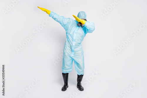 Full length photo of dabber man dance close cover face hands wear white biohazard uniform breathing mask isolated grey color background