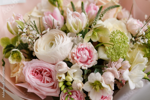 Spring pastel bouquet with roses closeup. Peony rose. Tulips ranunculus. Flower shop. Spring. Florist. Flower Background. Wallpaper.Woman s day.