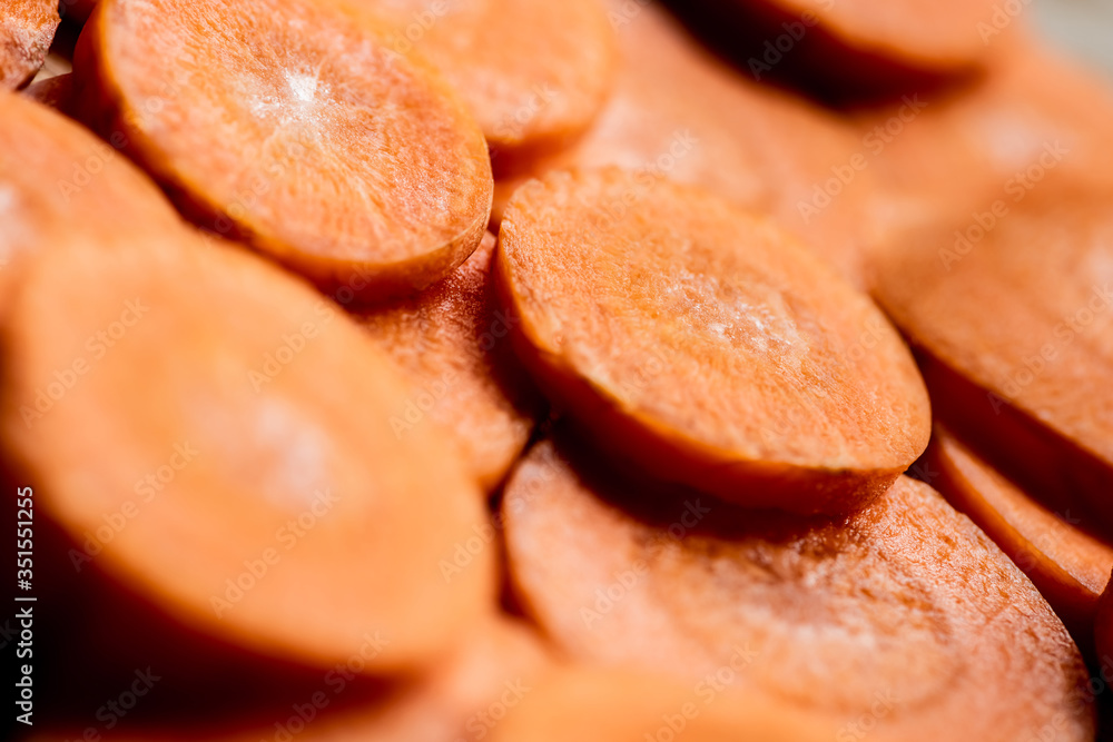 close up view of fresh ripe carrot slices close up view of fresh ripe carrot slices