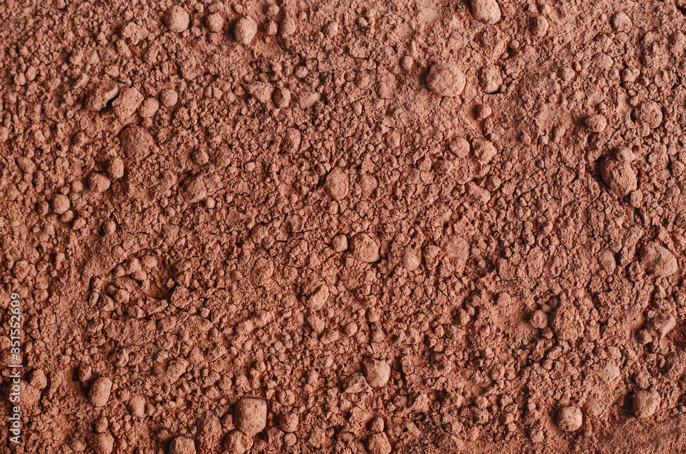Dry cocoa powder background close up. Dry cocoa powder background close up.