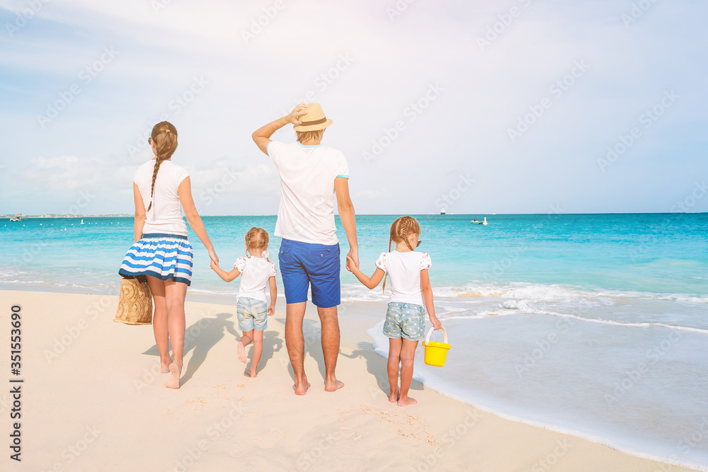 Naklejka premium Photo of happy family having fun on the beach. Summer Lifestyle