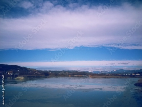 lake in fall season reflecting colorfully forest on the day © badescu