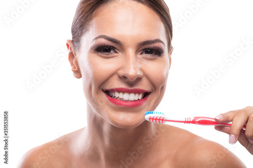Beautiful woman holding a toothbrush