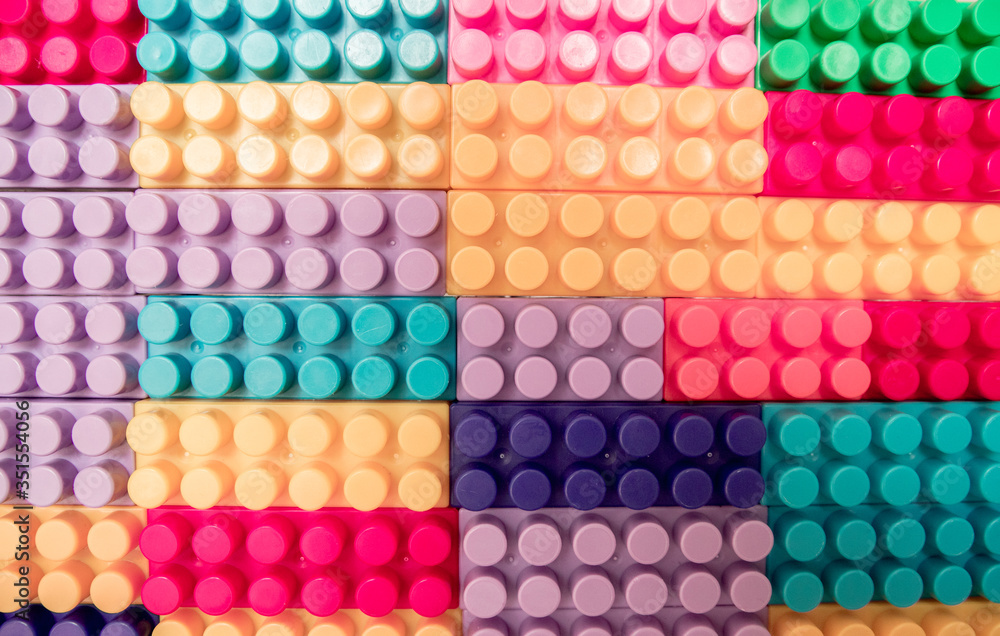 Designer items built like a wall. Color children's designer as background and texture. Designer items built like a wall. Color children's designer as background and texture.