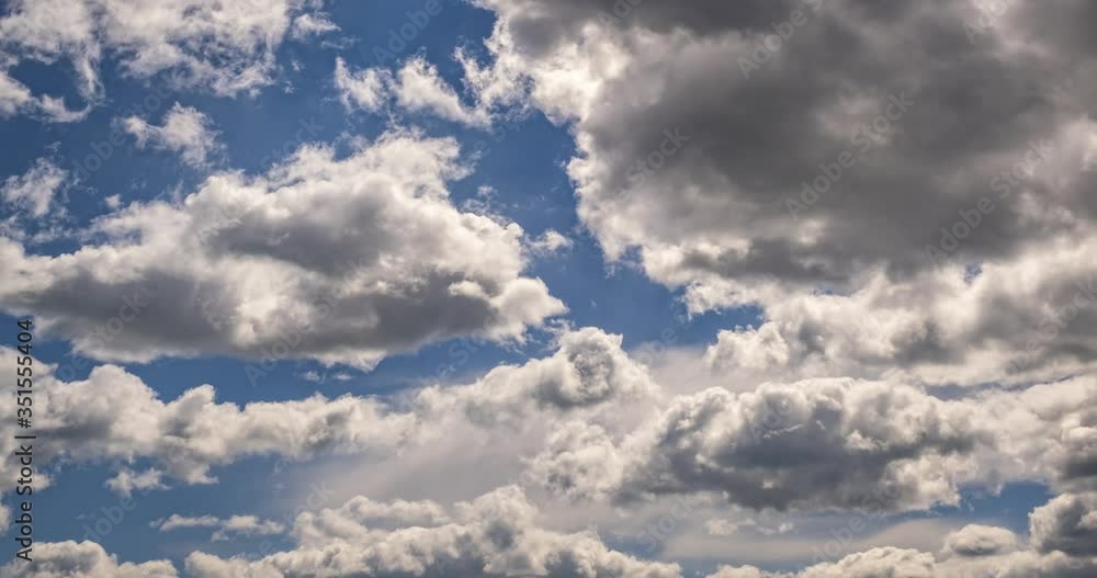 Time lapse clip of several fluffy curly rolling cloud layers in windy weather Time lapse clip of several fluffy curly rolling cloud layers in windy weather