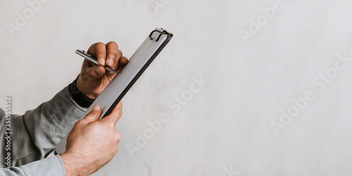 Canvas Print Engineer writing a report on a paper clipboard