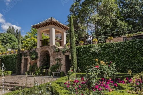Beautiful garden with fountain in Granada Alhambra. Granada, Andalusia, Spain.