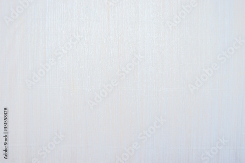 Wooden background covered with white paint. The tree texture is visible. Background and texture