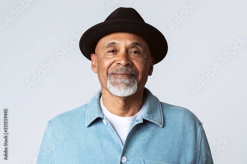 Happy senior man wearing a black hat photo