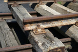 Hardened steel railroad tracks photographed on a sunny spring day