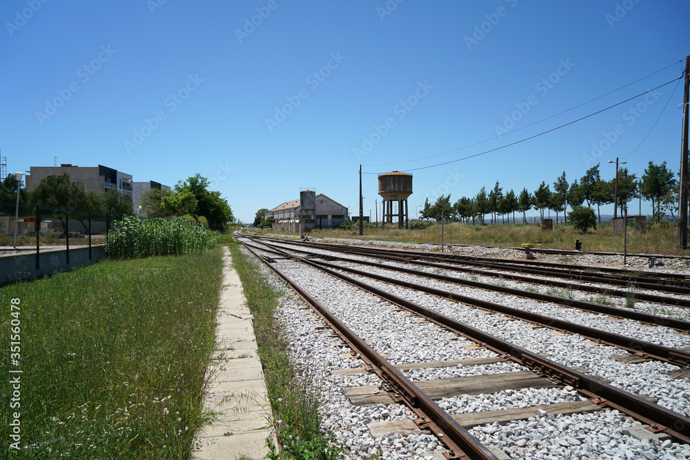 Fototapeta premium Hardened steel railroad tracks photographed on a sunny spring day