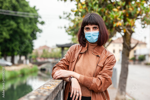 Girl with medical mask outdoor 16 photo