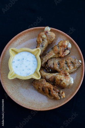 fried chicken wings with sour yogurt sauce