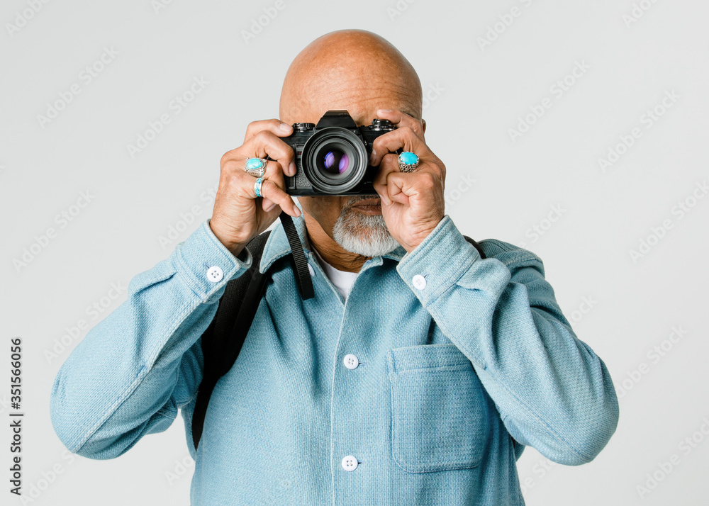 Senior man with a digital camera Senior man with a digital camera
