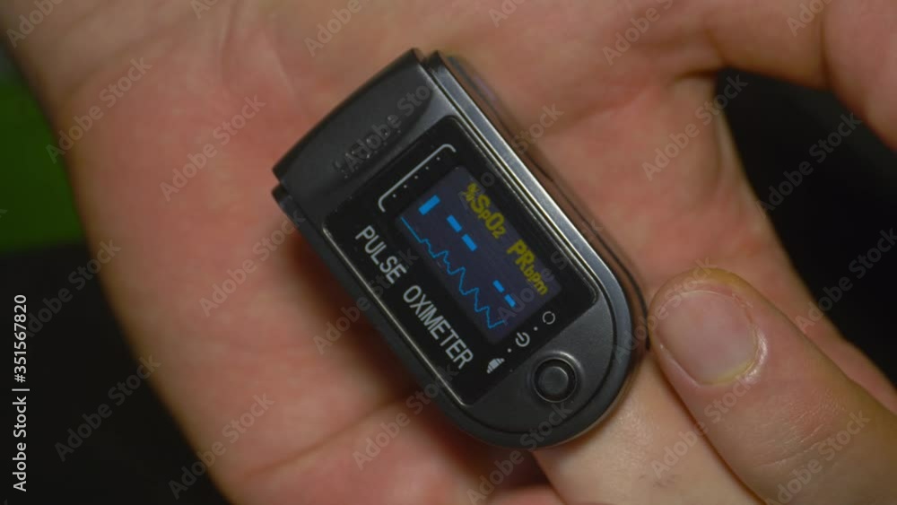 Pulse Oximeter at 98% saturation during patient test in index finger Pulse Oximeter at 98% saturation during patient test in index finger