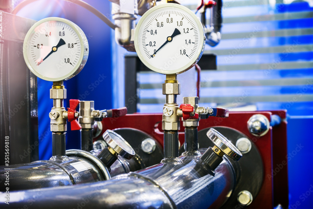 high pressure gauges installed on a water or gas system. Selective focus