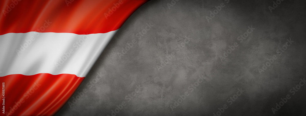 Austrian flag on concrete wall banner Austrian flag on concrete wall banner