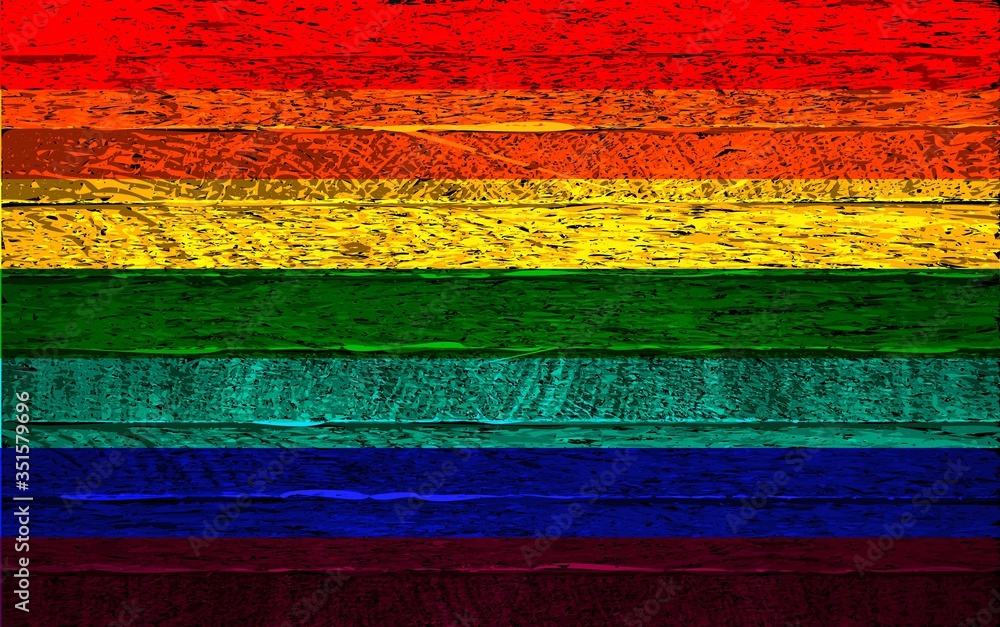 Rainbow LGBT flag on wood background