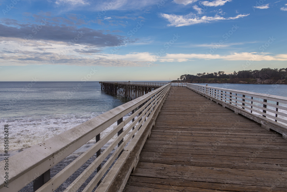 View of the wooden pier, San Simeon, California, USA.