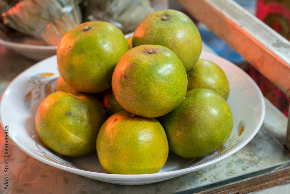 Oranges are in the white plate in Qingming day : Chinese show the respect to ancestors. Oranges are in the white plate in Qingming day : Chinese show the respect to ancestors.