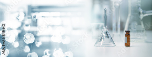 clear glass funnel and vial in chemical molecular structure blue research science laboratory for web banner background