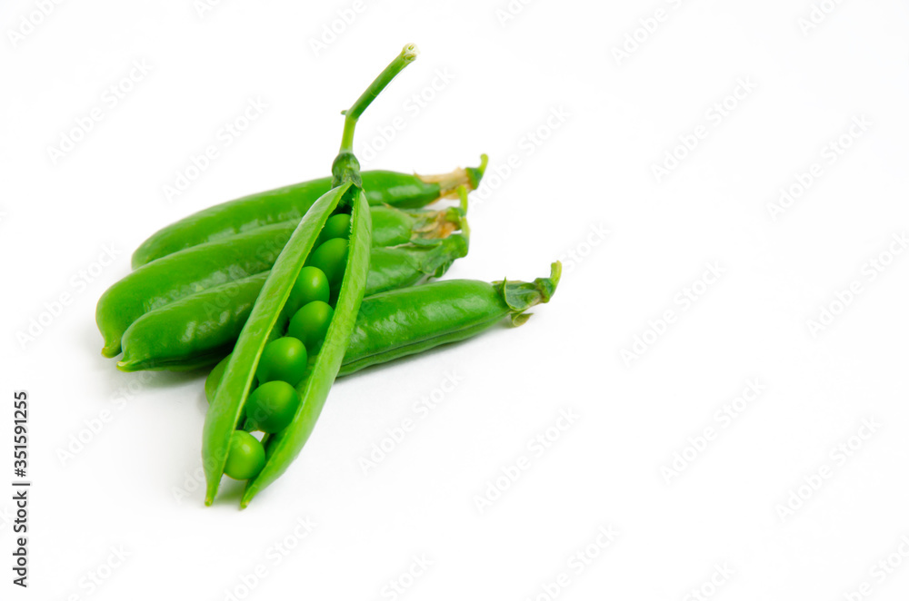 fresh, young green peas on a white background, the concept of a healthy diet vegetarianism fresh, young green peas on a white background, the concept of a healthy diet vegetarianism