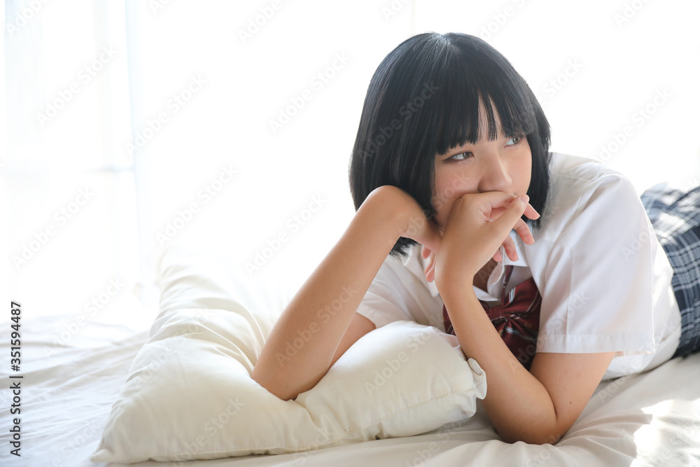 Portrait japanese school girl in white tone bed room Portrait japanese school girl in white tone bed room
