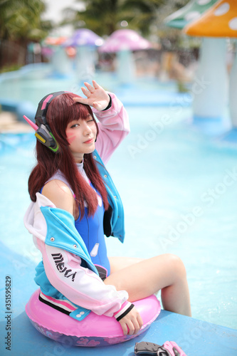 Japan anime cosplay , portrait of cosplay girl with swim suit at swimming pool