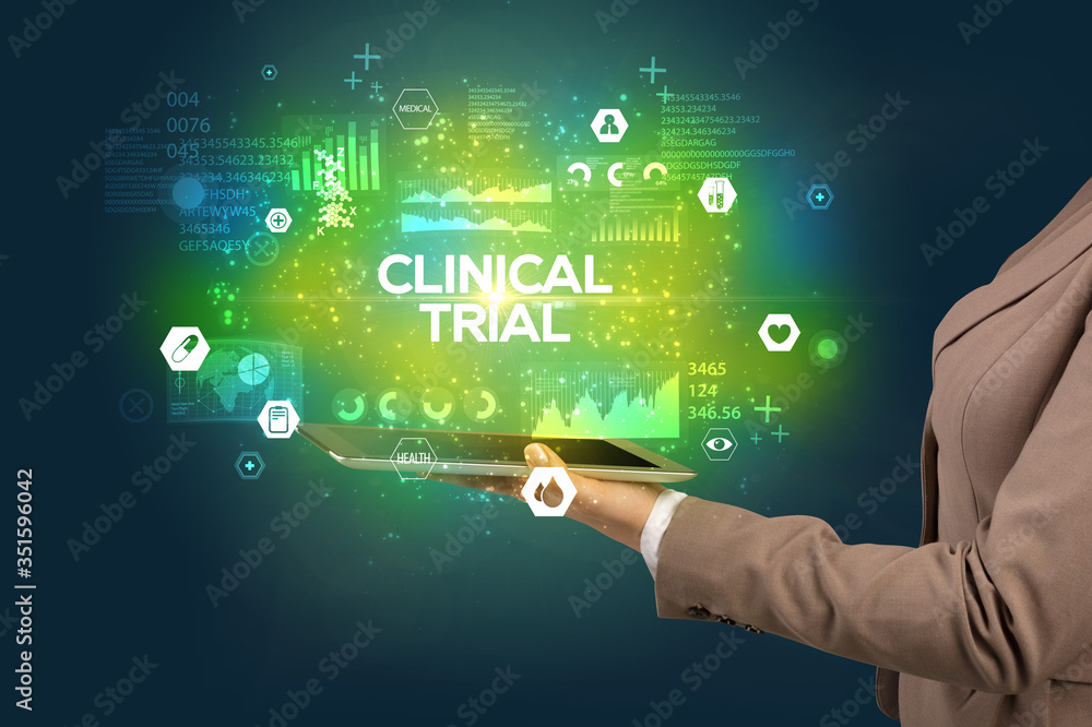 Close-up of a touchscreen with CLINICAL TRIAL inscription, medical concept Close-up of a touchscreen with CLINICAL TRIAL inscription, medical concept