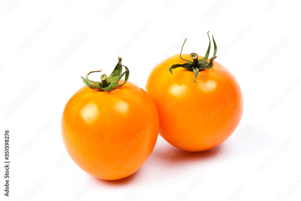 Yellow fresh tomatoes isolated on white background in close-up