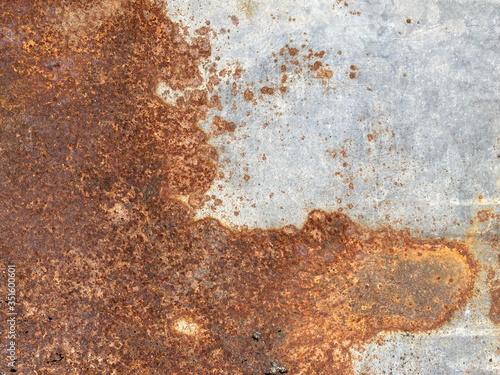 Yellow brown rust and dirt on Zinc Sheet. Rusted brown and satin silver abstract texture. metal surface rusted spots.metal rust background.