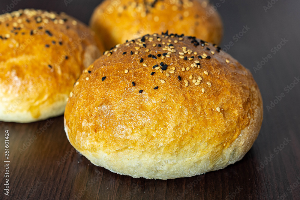 Group of three whole homemade burger bun Group of three whole homemade burger bun