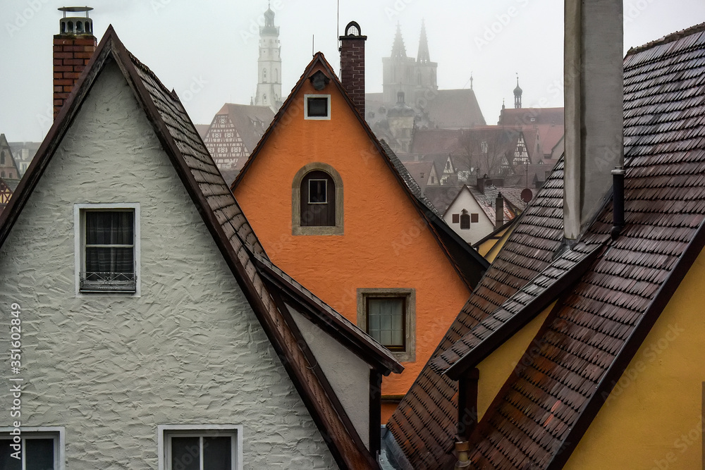 Fototapeta premium View from town wall of facades and roofs of medieval old town Rothenburg ob der Tauber, Bavaria, Germany. November 2014