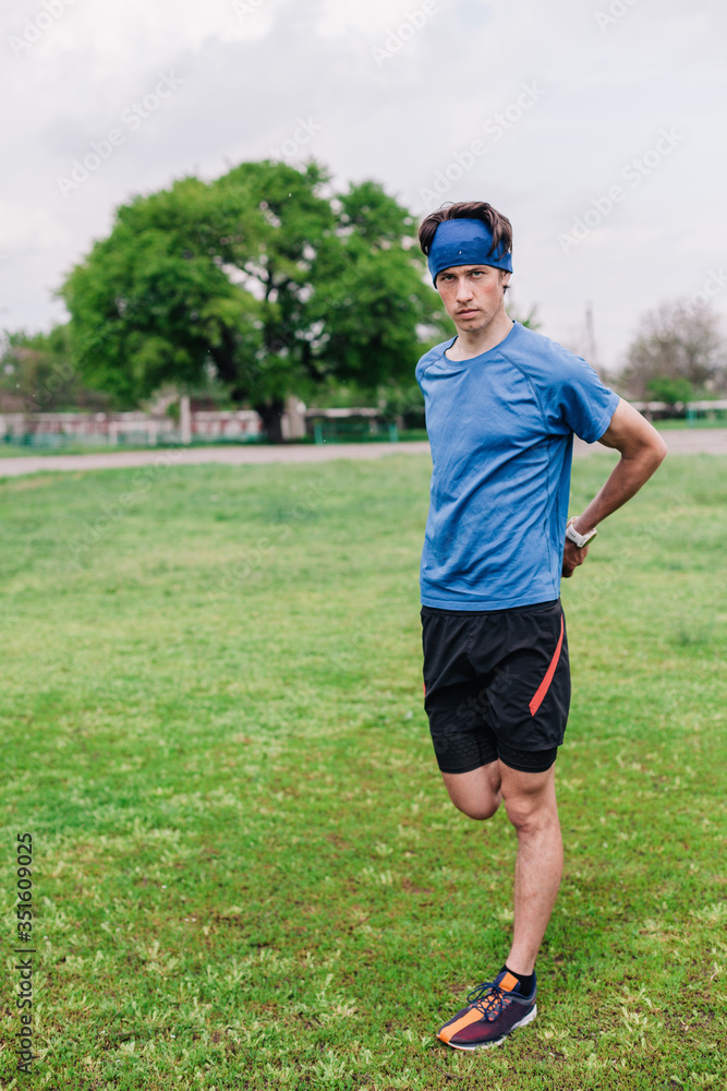 Athlete does warm-up before running at stadium