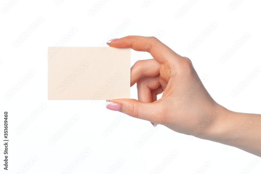 Female hand with blank white business card isolated on white Female hand with blank white business card isolated on white