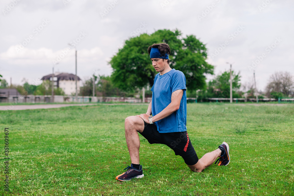 Athlete does warm-up before running at stadium