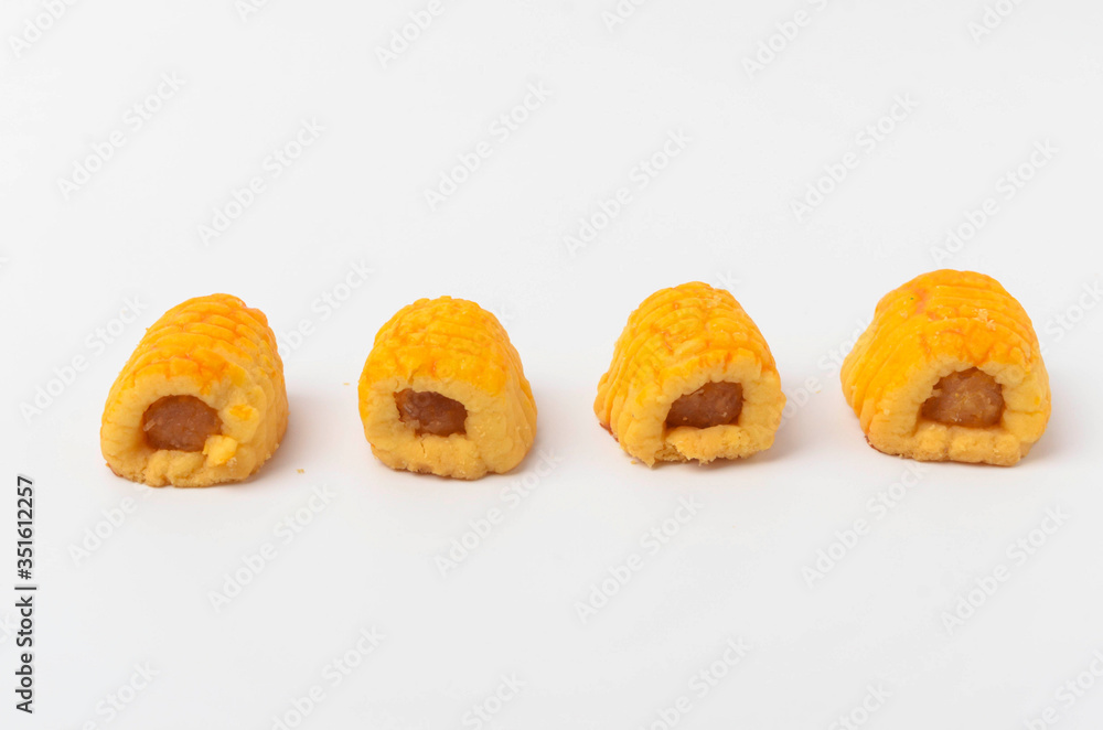 Pineapple roll tart cookies known as Tat Nenas isolated on white background. Modern cookies for Hari Raya Aidilfitri (Eid UI-Fitr) celebration. Pineapple tart isolated. Pineapple roll tart cookies known as Tat Nenas isolated on white background. Modern cookies for Hari Raya Aidilfitri (Eid UI-Fitr) celebration. Pineapple tart isolated.