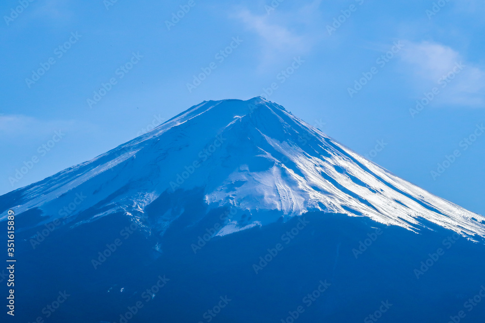 Beautiful and famous Mt. Fuji in Japan. Blue with sunny with snow covering the peak.