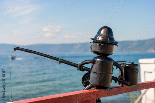 Fisherman shape on the railing at Listvyanka