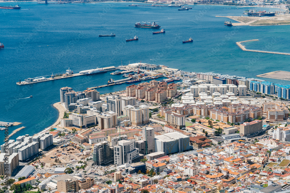 Gibraltar landscape, aerial view on gibraaltar coastal line with buildings and a bay with ships