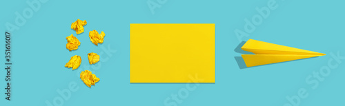 Crumpled paper, blank sheet and crafted plane on blue background. The concept of brainstorm and learning. Abstract creative image in minimalistic style.