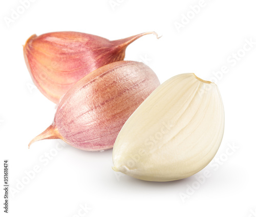 Garlic cloves on white. Garlic clove isolated. Peeled, unpeeled garlic cloves.