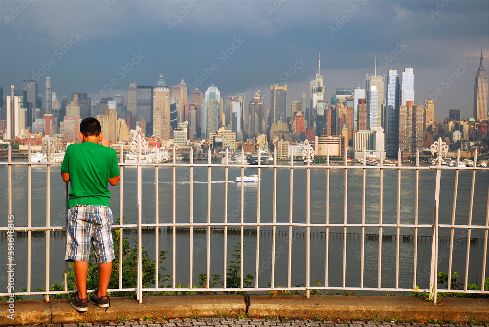 A young man takes in the Manhattan view from a lookout in Weehawken, New Jersey 