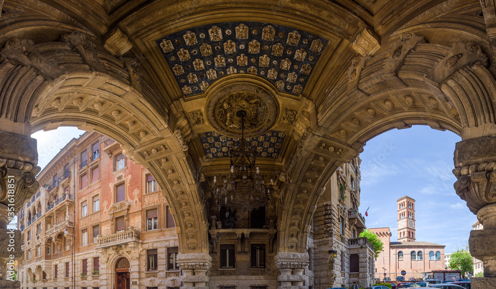 Panoramic composite of arch gallery ceiling, with stone carvings and painted patterns in Quartiere Coppedè, a 20th century Liberty Style architecture district in Rome, Italy
