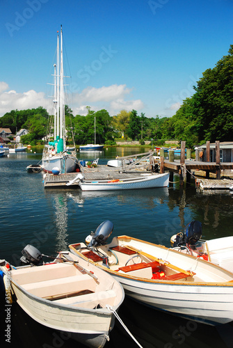 Summertime with boats tied at a harbor in Cape Cod  photo