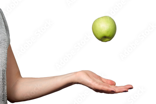 Hand throwing apple